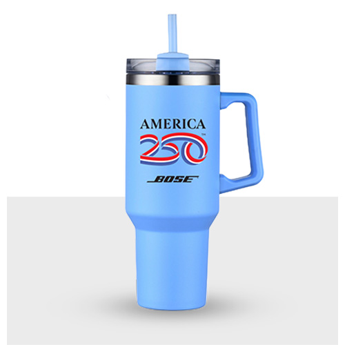 Blue 40 oz. tumbler with handle and straw showing America250™ official logo