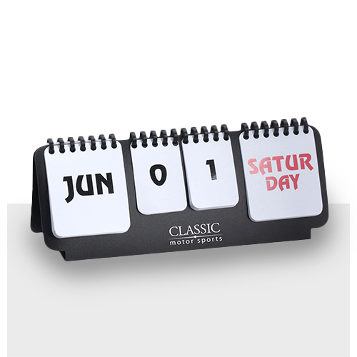Perpetual desk calendar with a company logo showing the date of Saturday June 1st