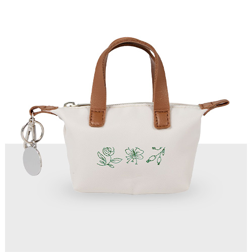 White miniature tote bag key chain with tan handle